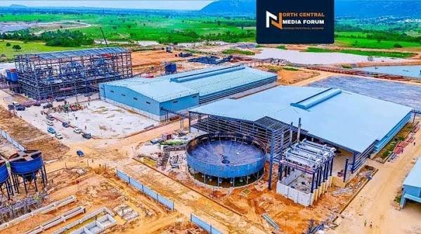 The official commissioning of the Nasarawa lithium processing plant with President Tinubu's representatives, the Solid Minerals Minister and the processing facility in the background.