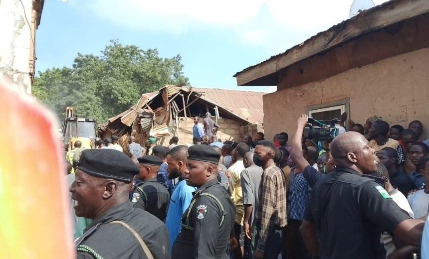 Emergency responders search through rubble after a two-storey building collapsed in Ilorin, Kwara State.