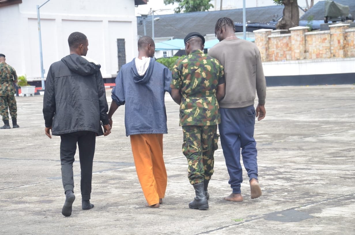 Nigerian Navy personnel intercept three suspected stowaways aboard a merchant vessel off Lagos
