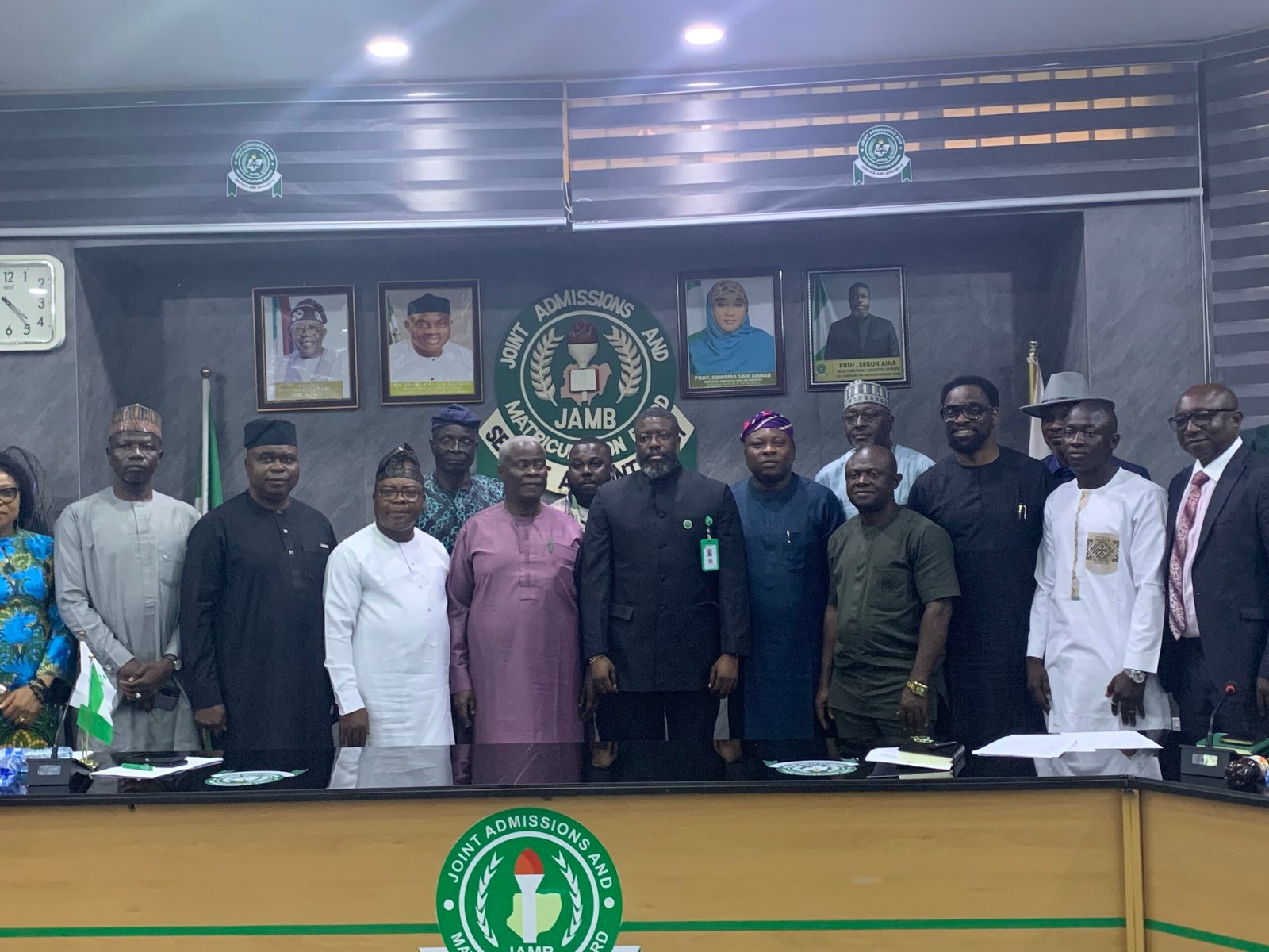 JAMB Registrar Segun Aina with committee members during the inauguration of the UTME reform committee in Abuja