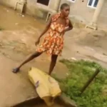 Ogun Arrests Woman Filmed Dumping Refuse Into Drainage in Viral Video