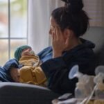 Mother holding newborn as experts examine postpartum mental illness and criminal responsibility