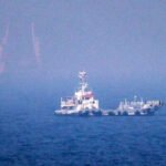 Oil tanker sails through the Strait of Hormuz amid escalating US-Iran military tensions.
