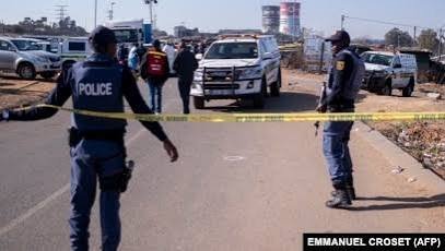 Police investigate a shooting scene in South Africa