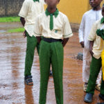 12-year-old Salisu Abbas stands barefoot at Nyanya Hausawa school in Abuja