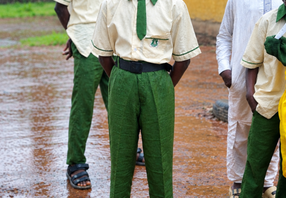 12-year-old Salisu Abbas stands barefoot at Nyanya Hausawa school in Abuja