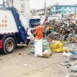 Waste truck evacuating refuse during the Lagos environmental sanitation exercise in Mafoluku.