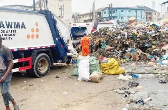 Waste truck evacuating refuse during the Lagos environmental sanitation exercise in Mafoluku.