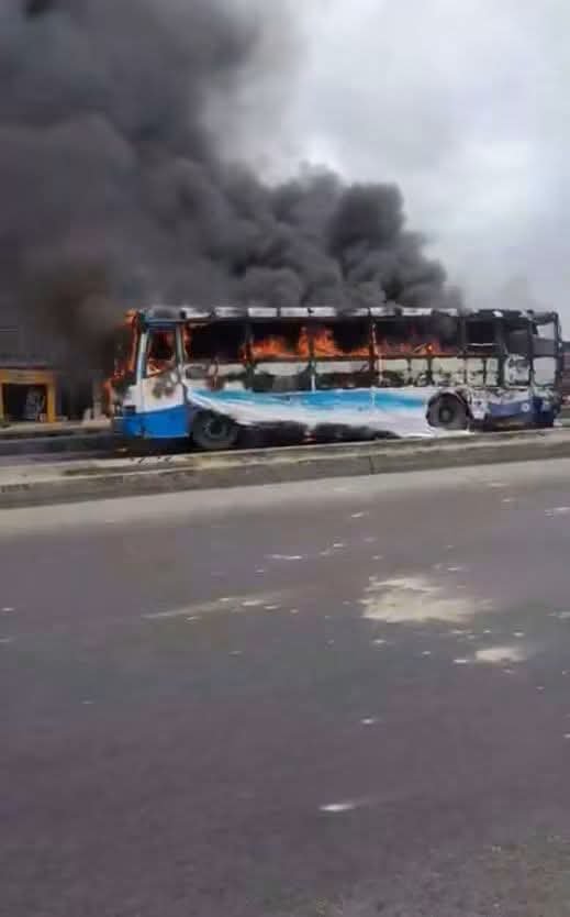 Charred remains of a BRT bus reportedly set ablaze after a fatal motorcycle crash at Ogolonto, Lagos.