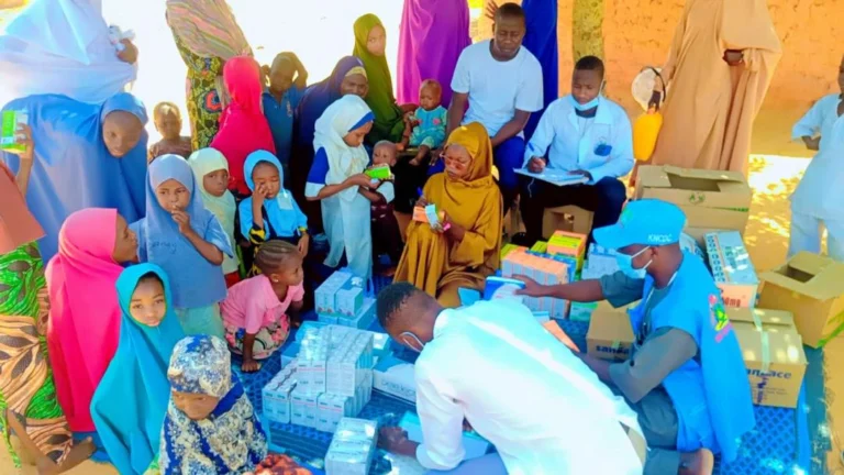 Healthcare personnel prepare medicines for distribution to children in communities in Makoda Local Government Area, Kano State.