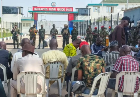 Retired military personnel protest over the calculation of pension increases outside the Military Pensions Board office in Abuja.