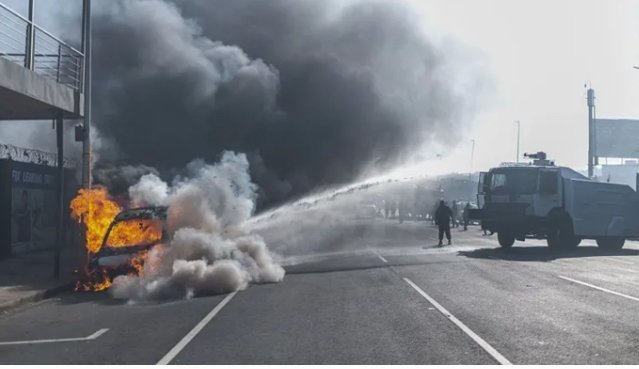 Burnt vehicles and damaged businesses amid xenophobic violence in South Africa