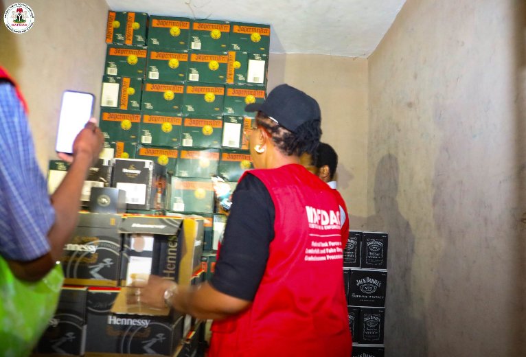 NAFDAC enforcement operation at the Lagos International Trade Fair Complex where suspected counterfeit alcoholic beverages and prohibited products were seized.