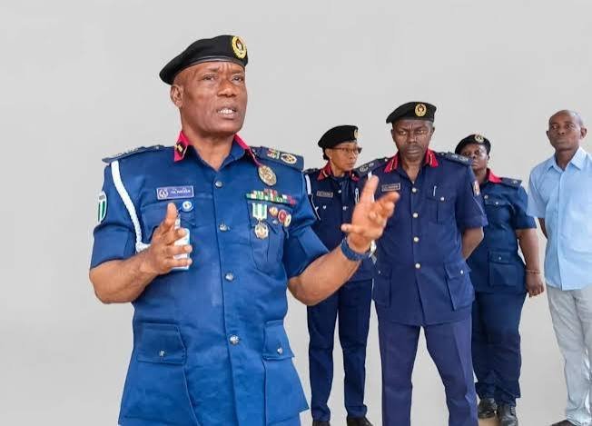 NSCDC Anambra State Commandant Olatunde Maku addresses personnel during a muster parade.