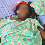Mrs Angela Nzurumike lies critically ill in a hospital bed before her death during the AHR 's report. (Photo credit: Esther, her daughter)