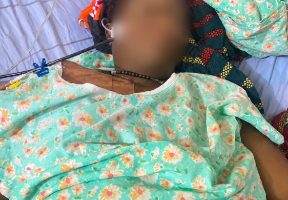 Mrs Angela Nzurumike lies critically ill in a hospital bed before her death during the AHR 's report. (Photo credit: Esther, her daughter)