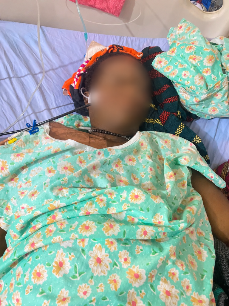 Mrs Angela Nzurumike lies critically ill in a hospital bed before her death during the AHR 's report. (Photo credit: Esther, her daughter)