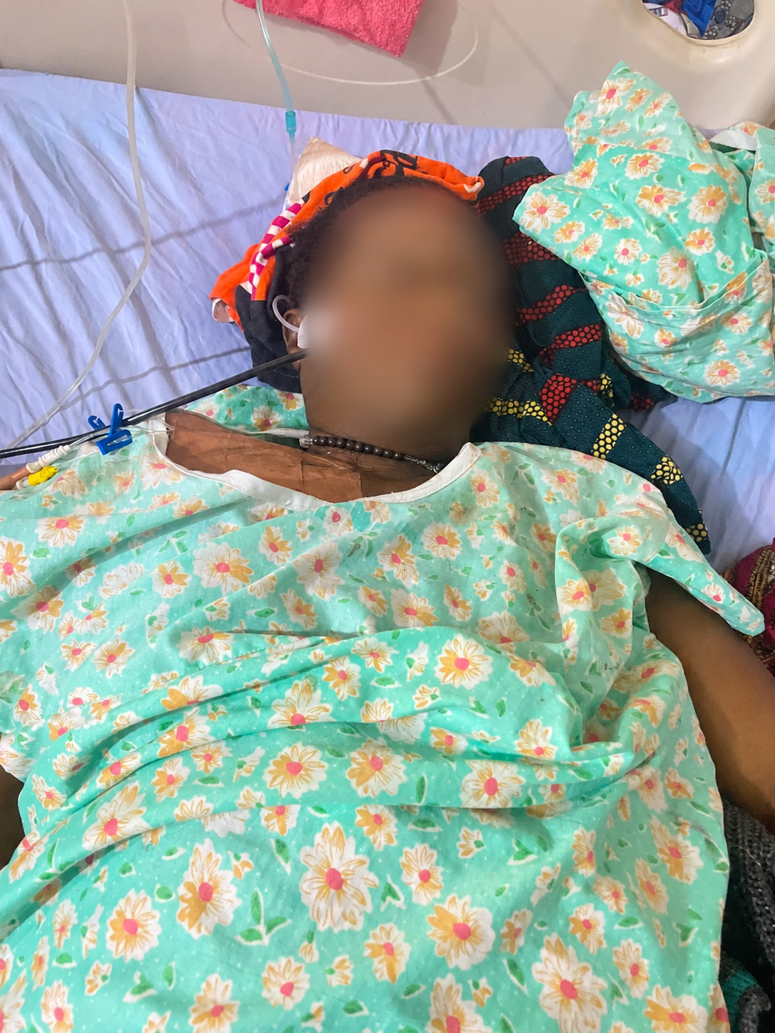 Mrs Angela Nzurumike lies critically ill in a hospital bed before her death during the AHR 's report. (Photo credit: Esther, her daughter)